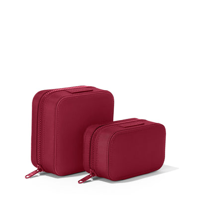 Dagne Dover Small and Large Frankie Jewelry Cases in a spice red standing next to one another.