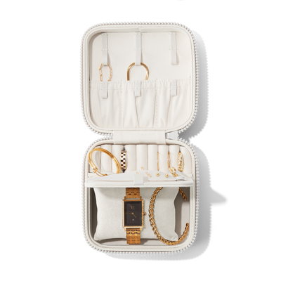 Dagne Dover Large Frankie Jewelry Case in white, seen open from above with jewelry inside the interior compartment.