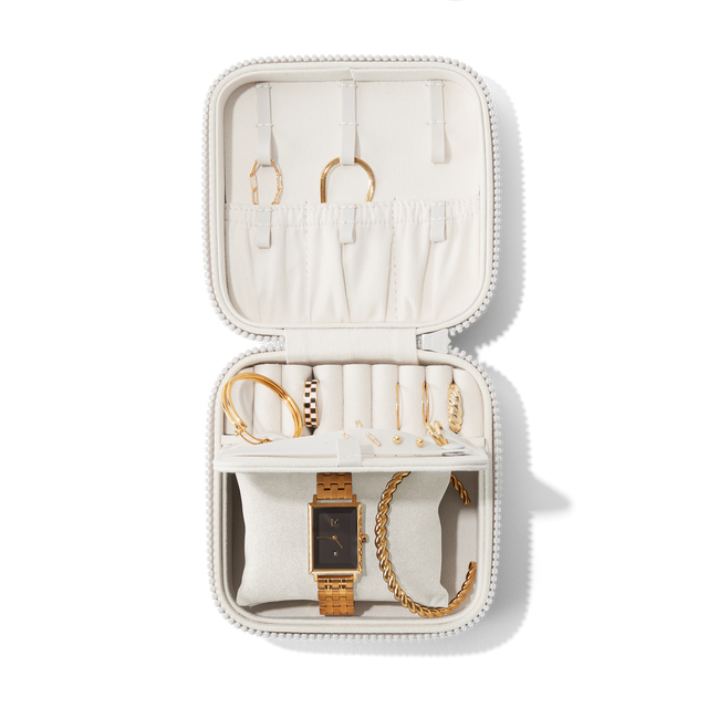 Dagne Dover Large Frankie Jewelry Case in white, seen open from above with jewelry inside the interior compartment.