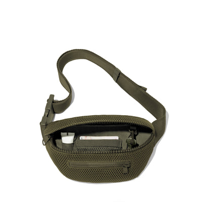 Dagne Dover Ace Fanny Pack in air mesh dark green  unzipped, exposing the interior pockets