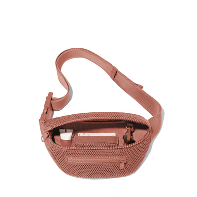 Dagne Dover Ace Fanny Pack in air mesh pink  unzipped, exposing the interior pockets