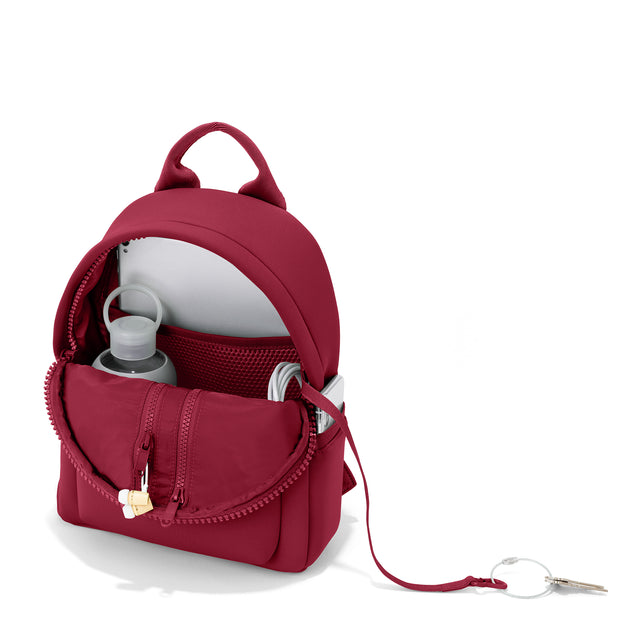 Dagne Dover small Dakota Neoprene Backpack in spice red unzipped, revealing the interior air mesh pockets. hover