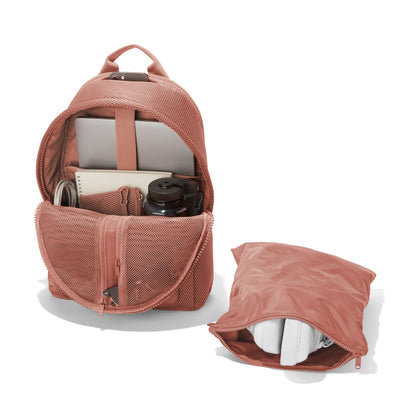 Dagne Dover large Dakota airmesh Backpack in pink unzipped, showing the interior pockets and shoe bag.