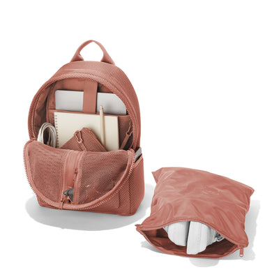 Dagne Dover medium Dakota airmesh Backpack in pink unzipped, showing the interior pockets and shoe bag.