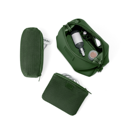 Dagne Dover Large Hunter Toiletry Bag in a rich, classic forest green unzipped and seen from above with the removable air mesh pouch alongside it. hover
