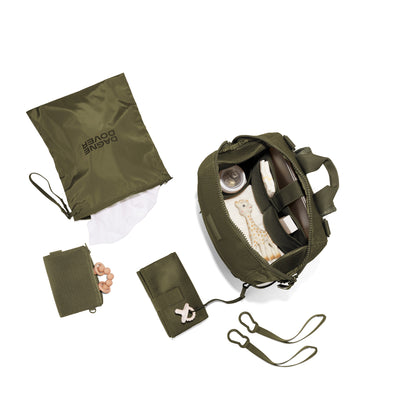 Dagne Dover Large Indi Diaper Backpack in dark green air mesh showing it's water resistant bag, interior pockets, and changing mat.