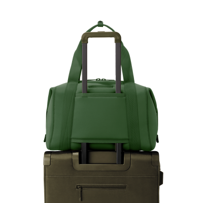 Dagne Dover large Landon Carryall in a rich, classic forest green displaying luggage sleeve.
