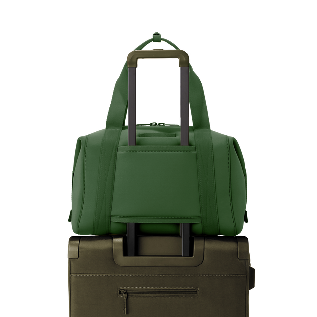 Dagne Dover large Landon Carryall in a rich, classic forest green displaying luggage sleeve.
