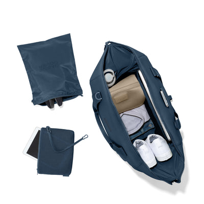 Dagne Dover Extra Large Landon Carryall in a medium grey-blue with a touch of turquoise unzipped, top down view. Hover