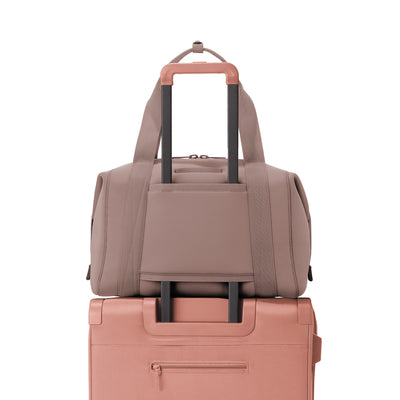 Large Landon Carryall in pink displaying luggage sleeve