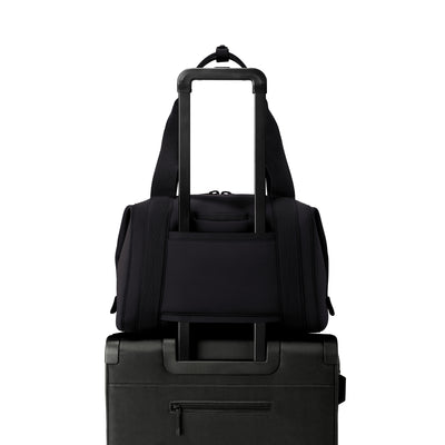 Medium Landon Carryall in black displaying luggage sleeve