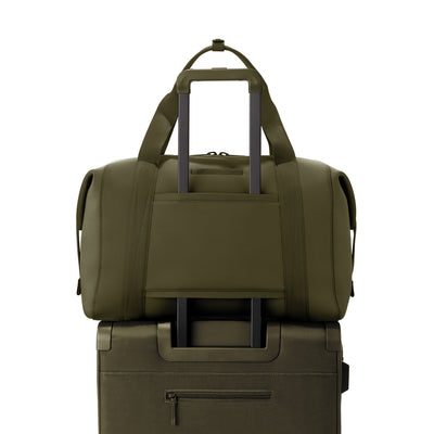 Extra Large Landon Carryall in dark green displaying luggage sleeve