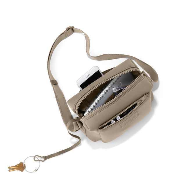 hover - Dagne Dover Micah Crossbody in khaki seen from above, showing the interior air mesh pocket. hover