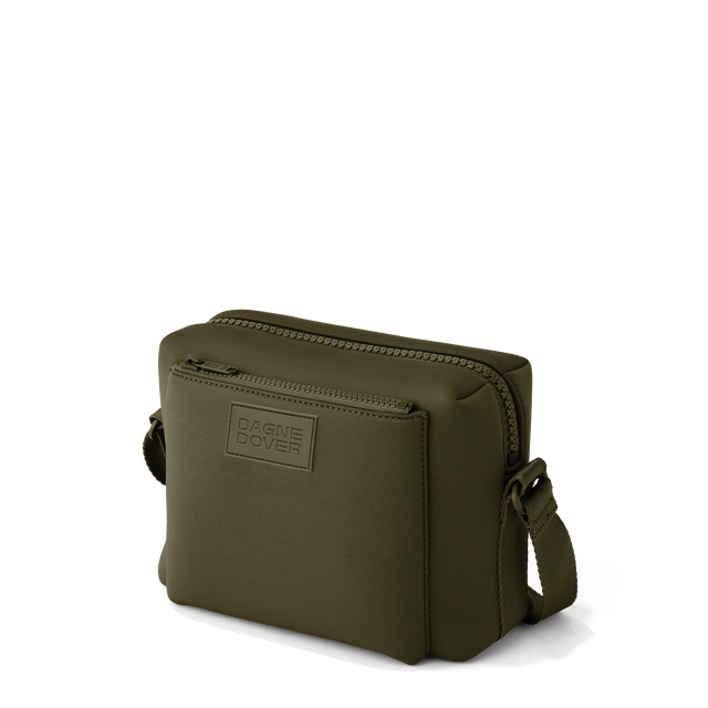 Dagne Dover Micah crossbody in dark green seen from an angle.