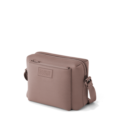 Dagne Dover Micah crossbody in pink seen from an angle.