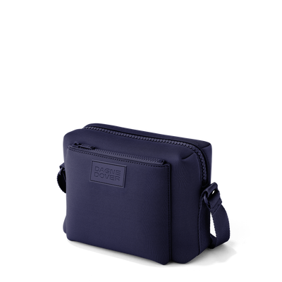 Dagne Dover Micah crossbody in dark blue seen from an angle.