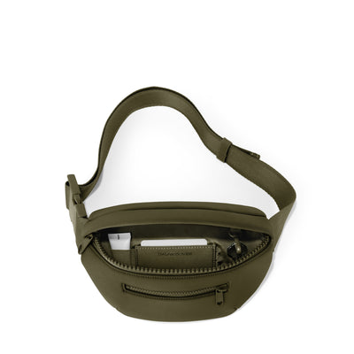 Dagne Dover Ace Fanny Pack in dark green  unzipped, exposing the interior pockets