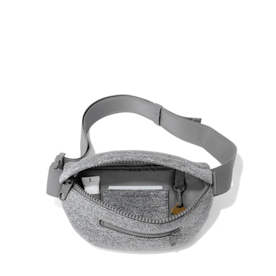 Dagne Dover Ace Fanny Pack in grey  unzipped, exposing the interior pockets