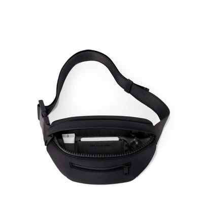 Dagne Dover Ace Fanny Pack in black  unzipped, exposing the interior pockets