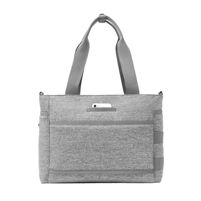 Dagne Dover large Wade Diaper Tote in grey seen from the back with a phone in the exterior phone pocket.