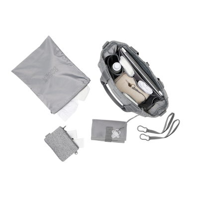 hover - Dagne Dover large Wade Diaper Tote in grey seen from above, alongside the changing mat, neoprene pouch, and water resistant zipper bag.