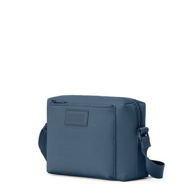 Dagne Dover Micah crossbody in moonlight blue seen from an angle.