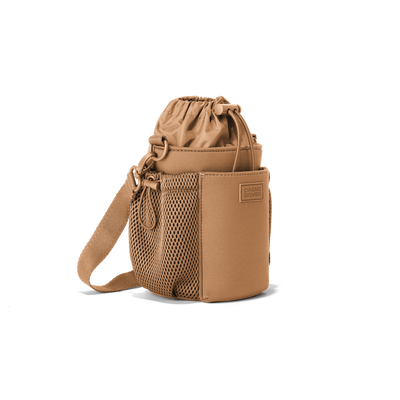 Dagne Dover Sloan Water Bottle Sling in camel brown seen from an angle.