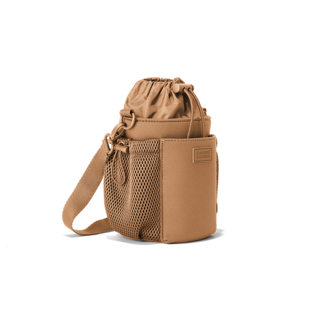 Dagne Dover Sloan Water Bottle Sling in camel brown seen from an angle.