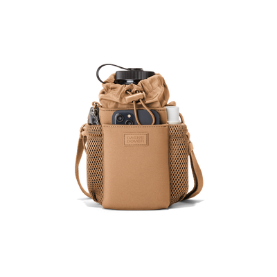 Dagne Dover Sloan Water Bottle Sling in camel brown containing a water bottle and accessories.