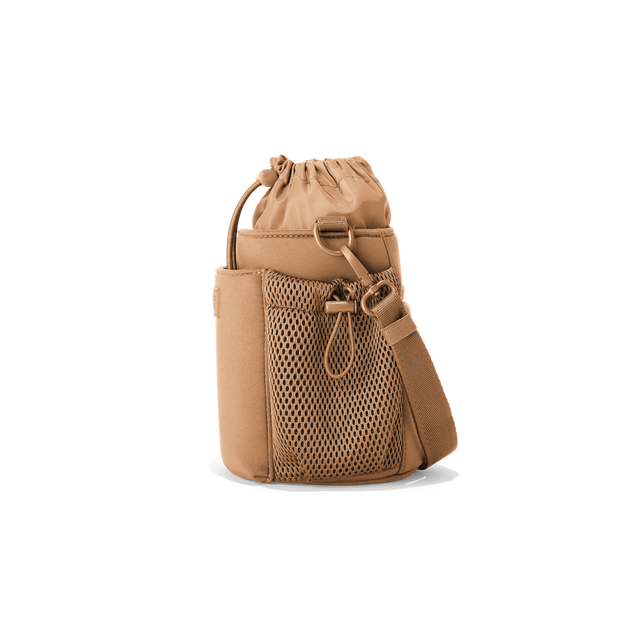 Dagne Dover Sloan Water Bottle Sling in camel brown seen from the side.