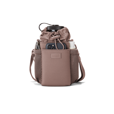 Dagne Dover Sloan Water Bottle Sling in a muted mauve containing a water bottle and accessories.