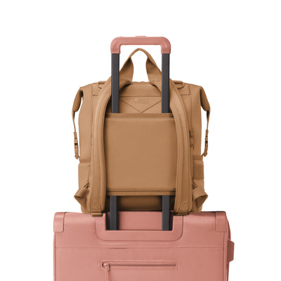 Dagne Dover Large Indi Diaper Backpack in camel brown showing the neoprene luggage sleeve.