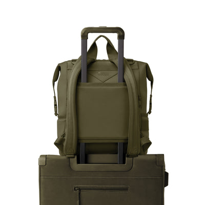 Dagne Dover Large Indi Diaper Backpack in dark green showing the neoprene luggage sleeve.