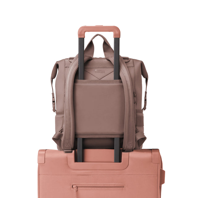 Dagne Dover Large Indi Diaper Backpack in dune pink showing the neoprene luggage sleeve.