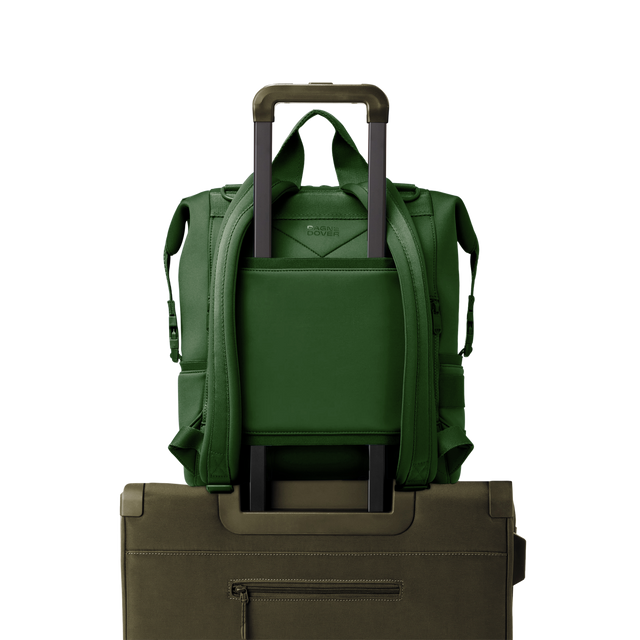 Dagne Dover Large Indi Diaper Backpack in a rich, classic forest green showing the neoprene luggage sleeve.
