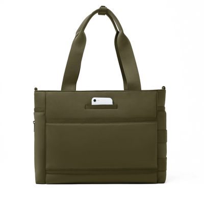 Dagne Dover large Wade Diaper Tote in dark green seen from the back with a phone in the exterior phone pocket.