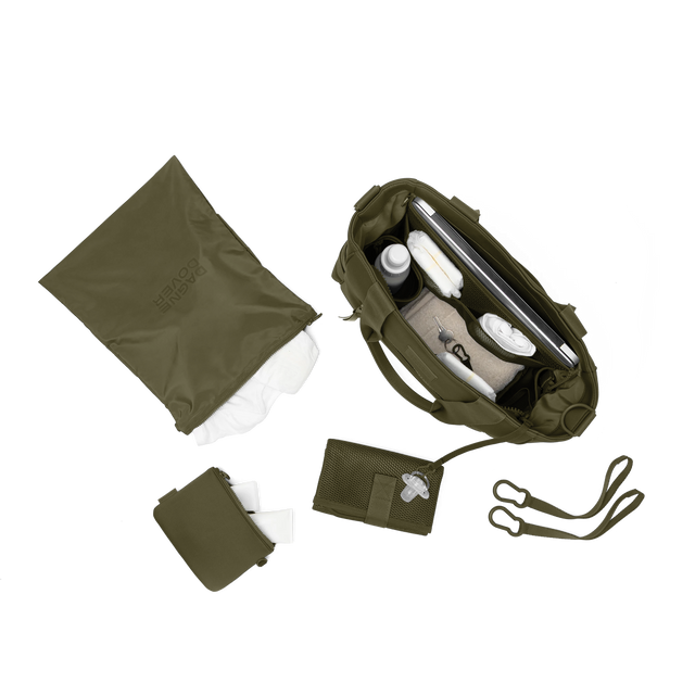 hover - Dagne Dover large Wade Diaper Tote in dark green from above, alongside the changing mat, neoprene pouch, and water resistant zipper bag.