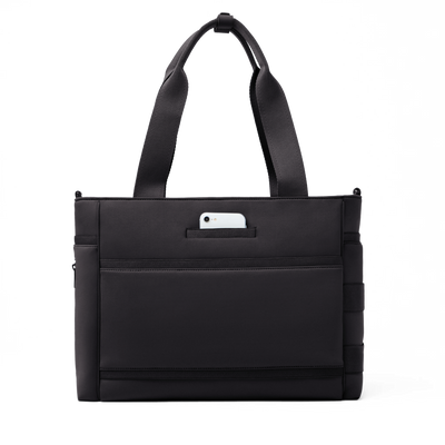 Dagne Dover large Wade Diaper Tote in black seen from the back with a phone in the exterior phone pocket.