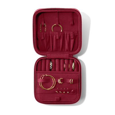 Dagne Dover Large Frankie Jewelry Case in a spice red, seen open from above with jewelry inside and the interior compartment closed. hover