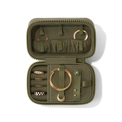 Dagne Dover Small Frankie Jewelry Case in dark green, seen open from above with jewelry inside and the interior compartment closed. hover