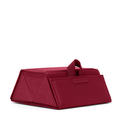 Dagne Dover Remi foldable glasses holder in spice red seen from an angle.