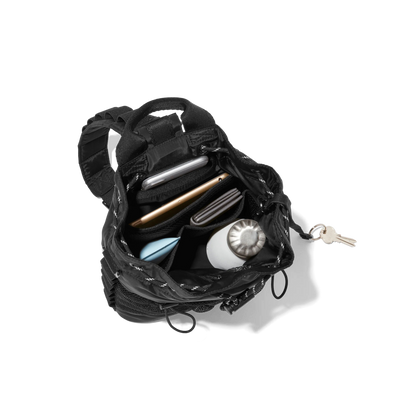 hover - Dagne Dover Nova Sling Bag in black opened, revealing the interior phone pocket and interior airmesh pockets.