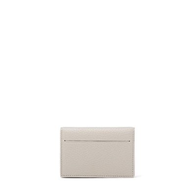 Dagne Dover Accordion Card Case in white revealing the external card slot.