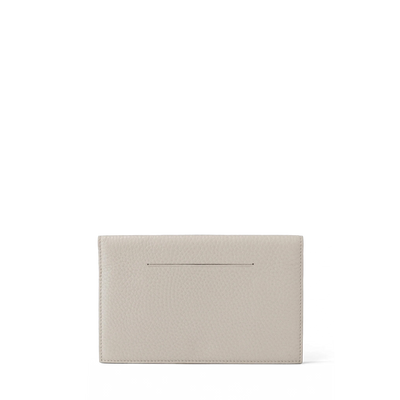 Dagne Dover Accordion Travel Wallet in white, revealing the external card slot.