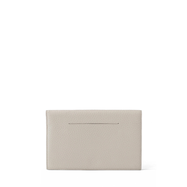 Dagne Dover Accordion Travel Wallet in white, revealing the external card slot.