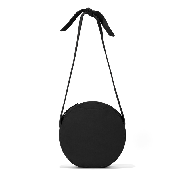 Dagne Dover Luna Shoulder Bag in black with the adjustable shoulder handle extended.