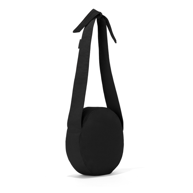 Dagne Dover Luna Shoulder Bag in black seen from an angle.