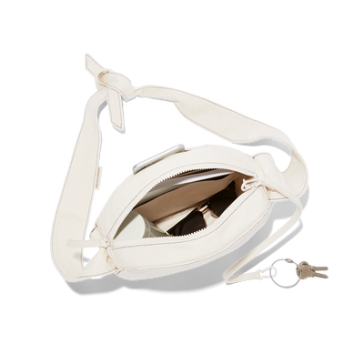 hover - Dagne Dover Luna Shoulder Bag in natural unzipped, revealing the interior slip pocket, interior zip pocket, and hidden magnetic closure.