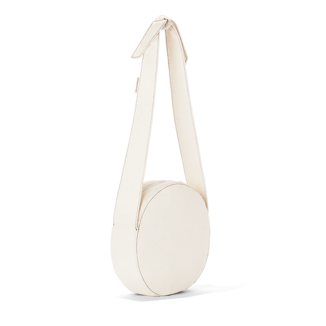 Dagne Dover Luna Shoulder Bag in white seen from an angle.