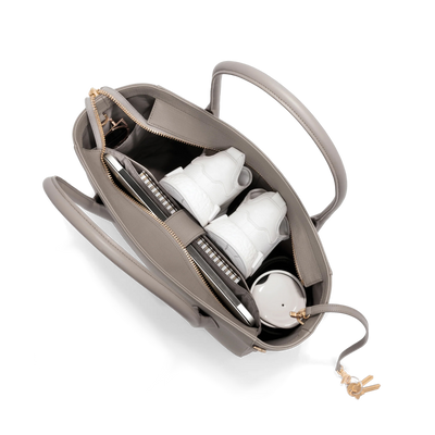 hover - Dagne Dover Legend Signature Leather Tote in beige seen from above, revealing 2 slip pockets, the neoprene bottle holder, and large interior zipper pocket.